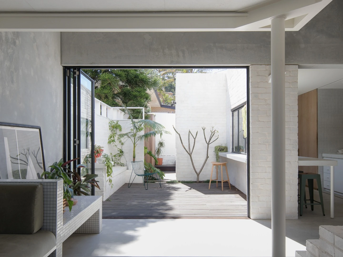 Large glass folding doors opne up onto the outdoor terrace