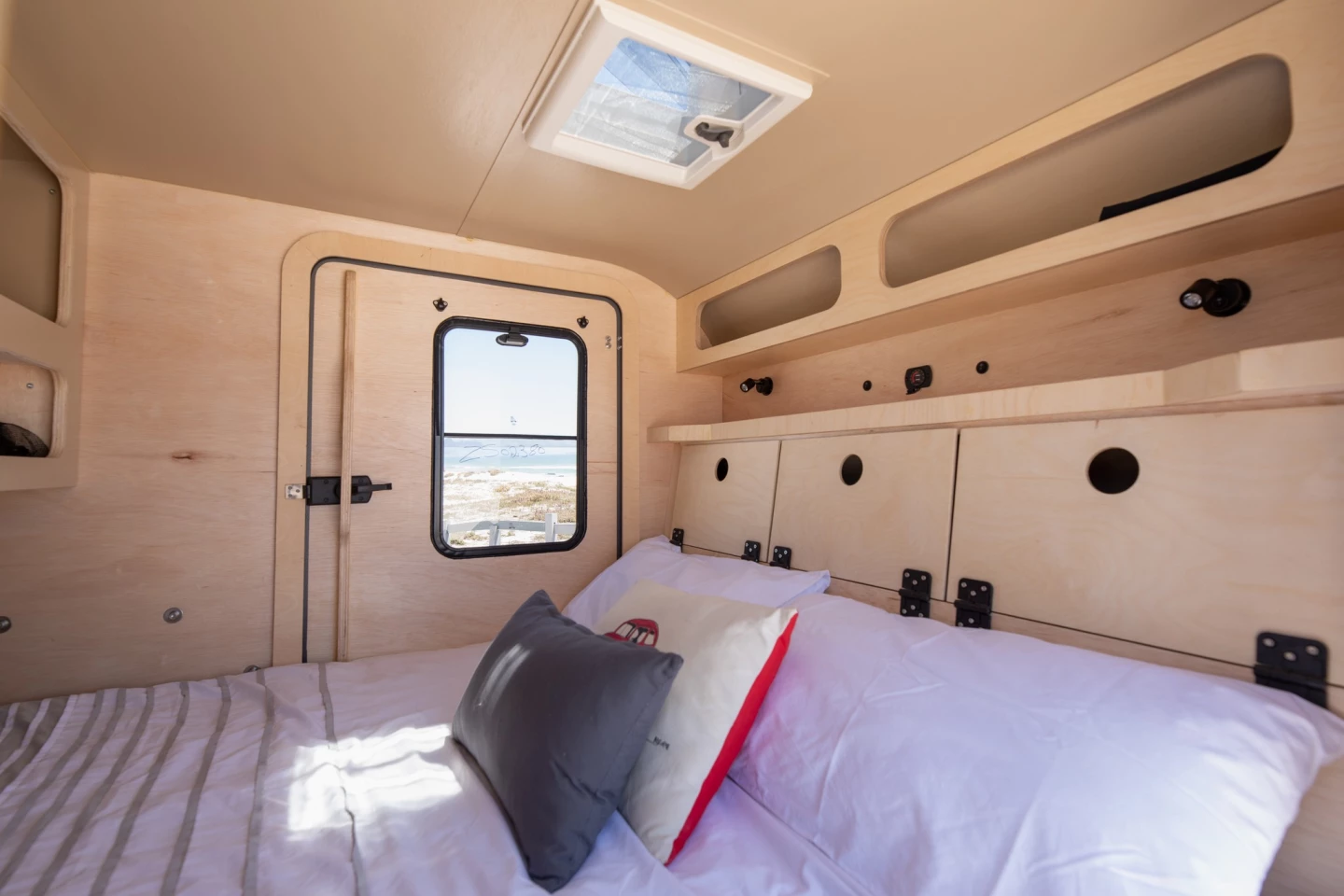 Red Gecko packs the TDX interior with loads of storage space and a double foam mattress