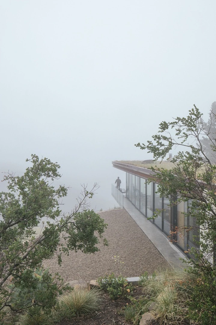 The Off-Grid Guest House's green roof helps it blend into the landscape
