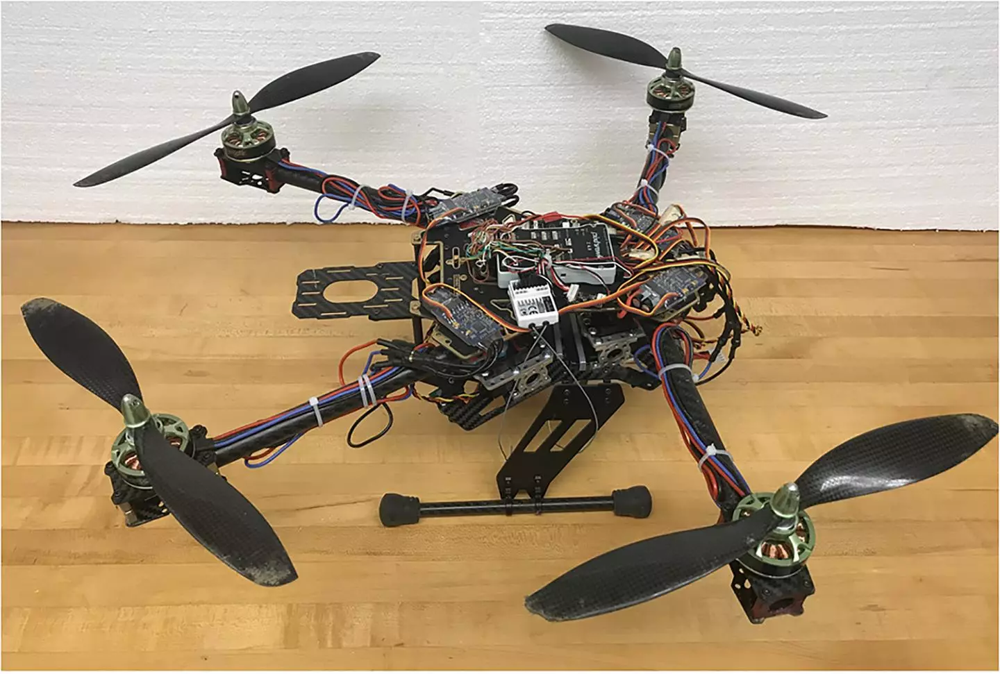 The folding-arm drone is claimed to be better than regular quadcopters at flying in the wind, lifting heavy asymmetric payloads, and making use of its full range of thrust