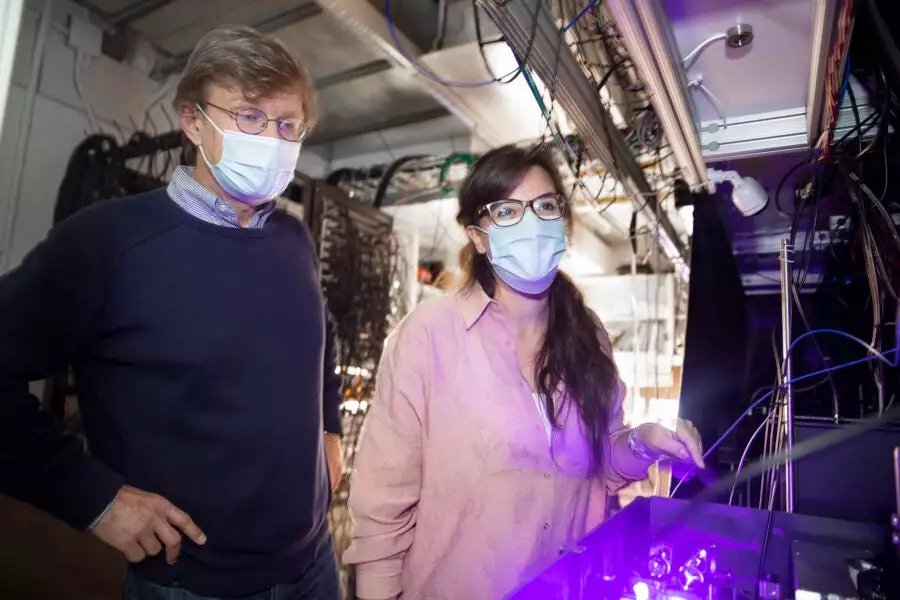 Harvard researchers Mikhail Lukin (left) and Giulia Semeghini (right) have led a team that observed an exotic state of matter called a quantum spin liquid for the first time