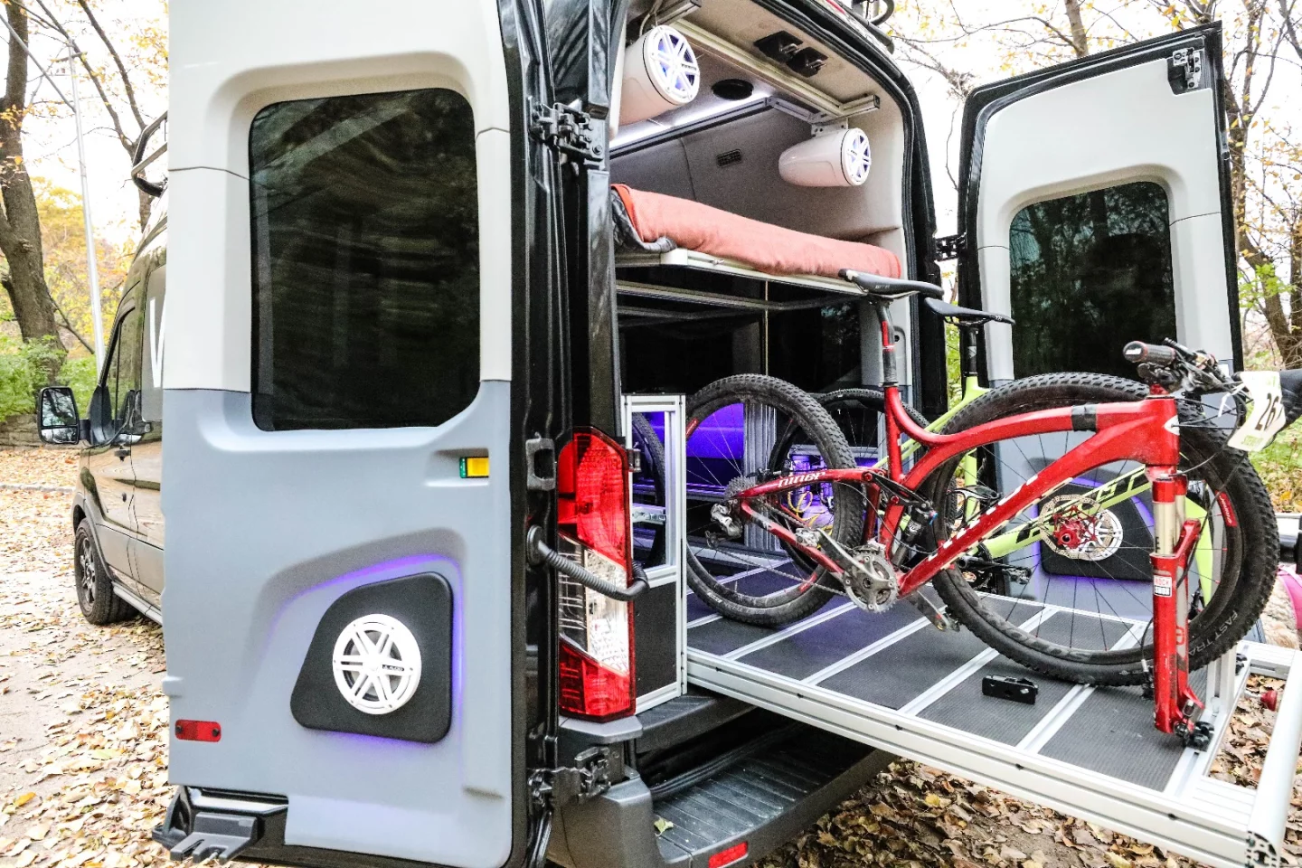 The hydraulic bed lifts out of the way for cargo hauling and drops down for sleeping