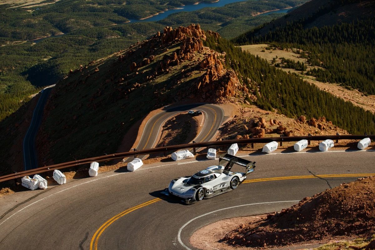 Romain Dumas and the Volkswagen I.D. R race car working their way up Pikes Peak fast enough to take the win and the all-time record