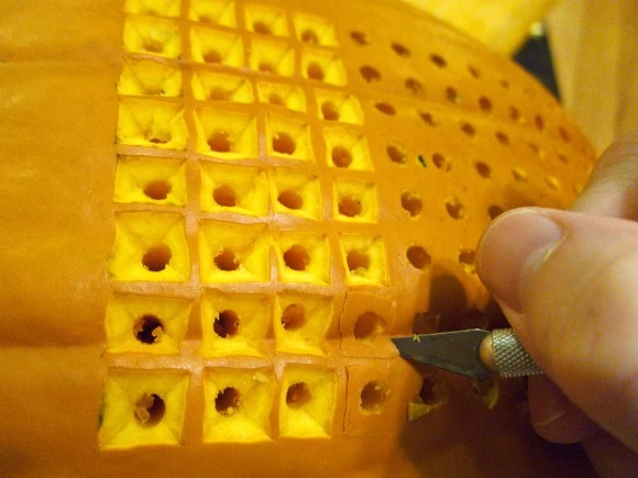 Squares were carved around each hole to give it that pixelated look