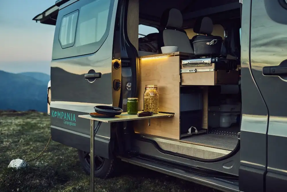 Preparing a meal with Kompanja's indoor/outdoor kitchen