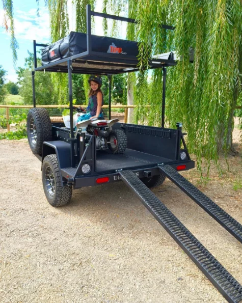 The available UGOAT Scout ramps help load vehicles before disappearing into the frame
