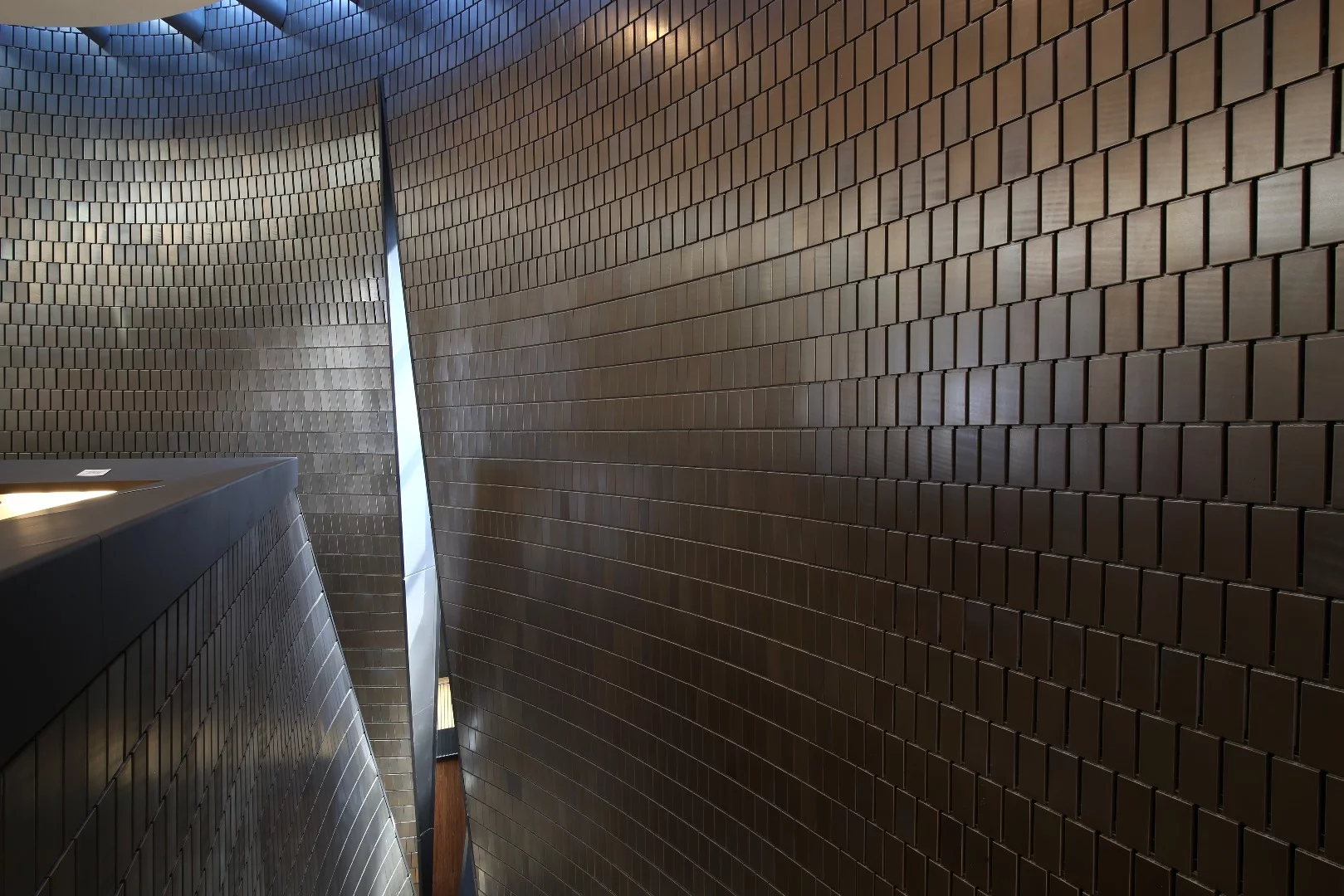 "The building is a powerful instrument that exists to emanate music and light. The walls, clad in terra cotta, rise in subtle curves that merge, part, and intertwine, modeled by light, gravity, and acoustics."