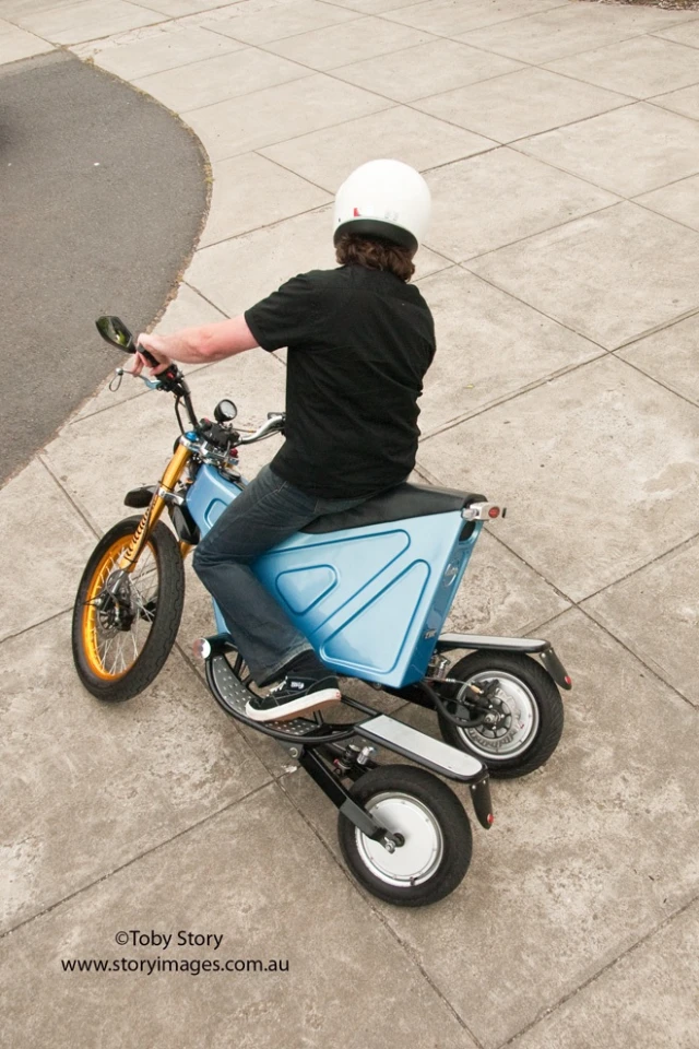 The prototype electric Deliver E-Trike has independently-pivoting rear swing arms, which allow it to stand upright when parked on grades