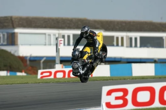 Craig Jones (riding) and Wing Chui (front wheel) breaking the world record at Donington.
