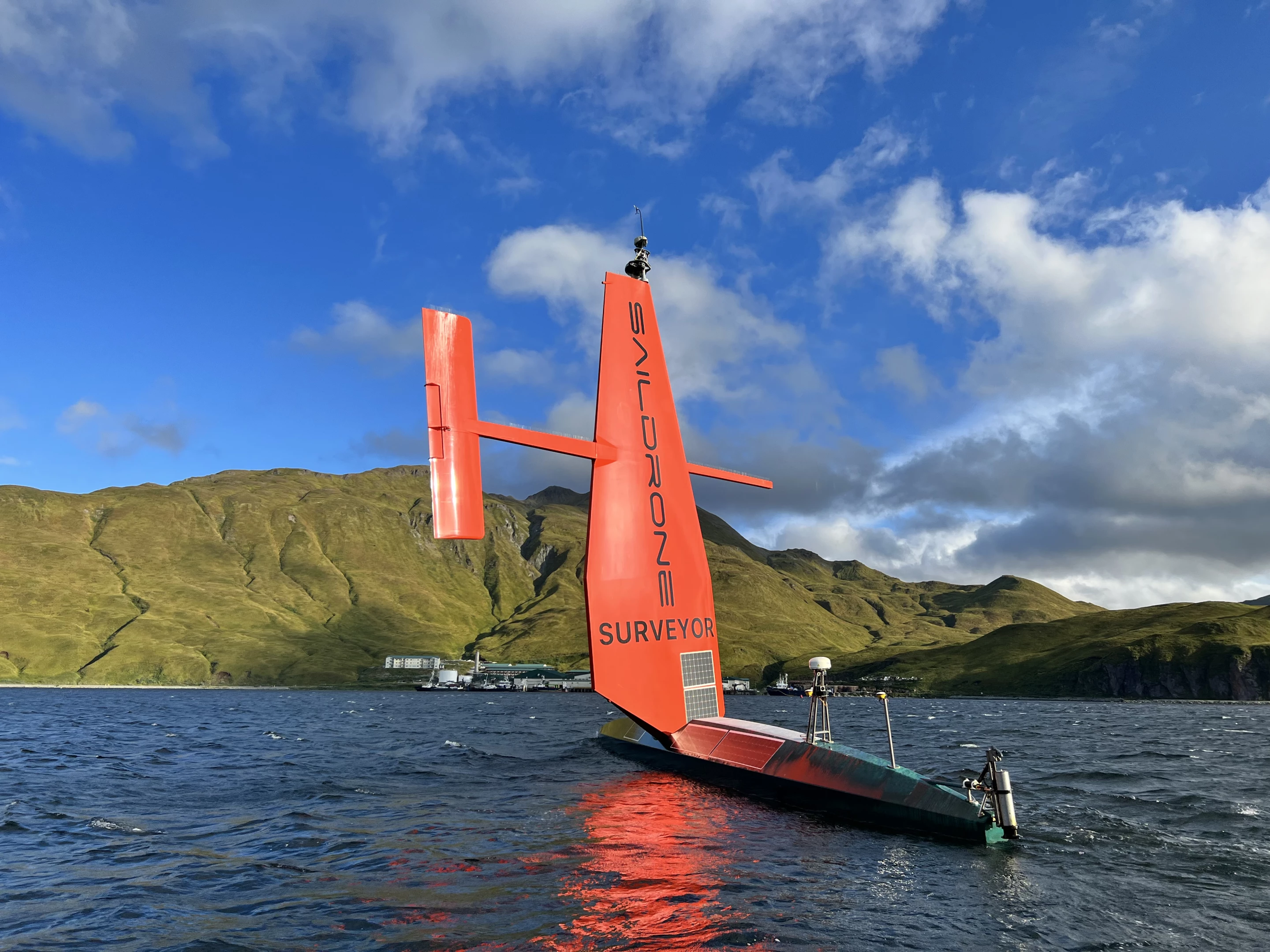 The 65-ft-long Saildrone SD 1200 is primarily propelled by wind, with solar panels powering onboard electronics and sensors