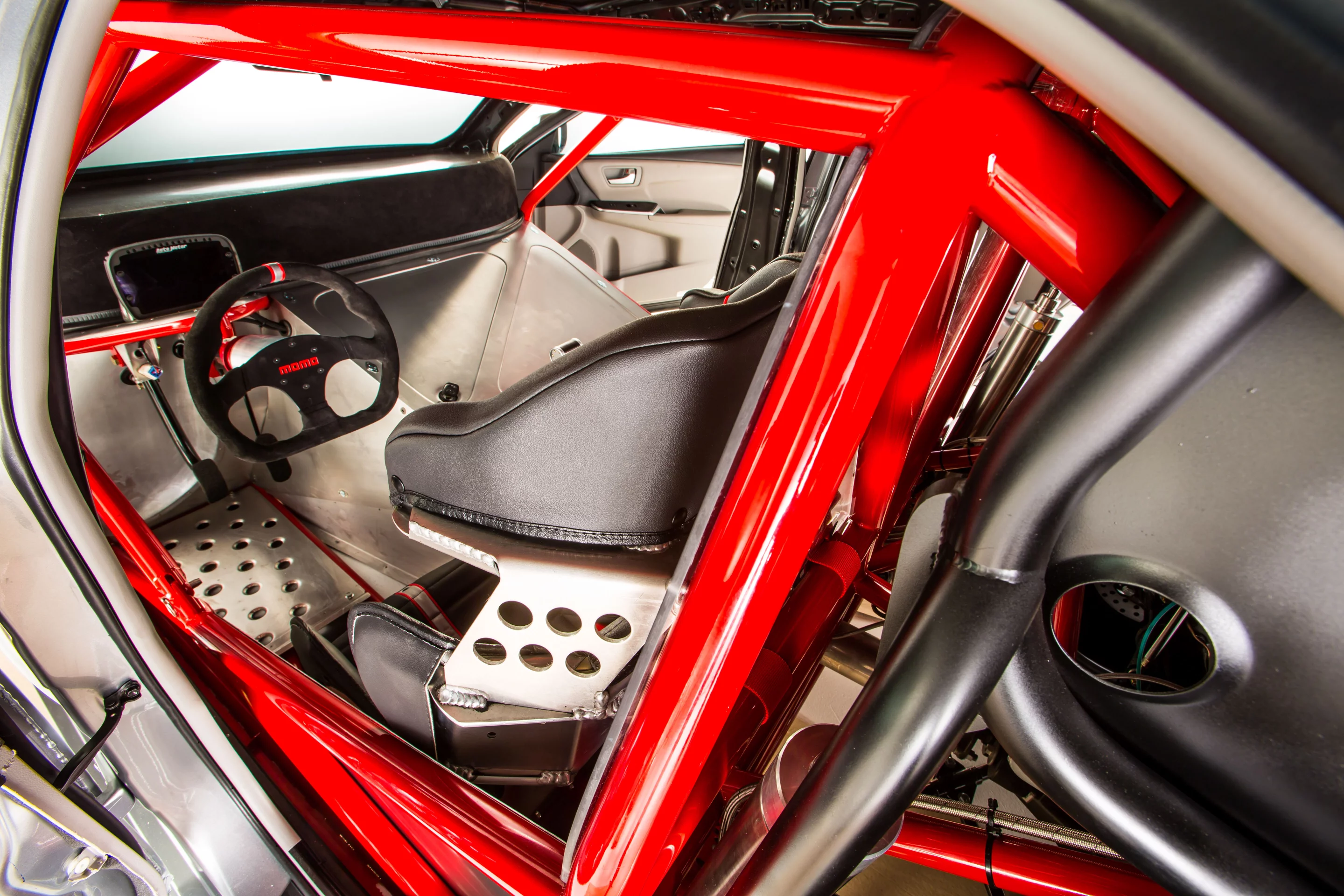 The interior includes a Fast Ed's seat and Autometer digital dash