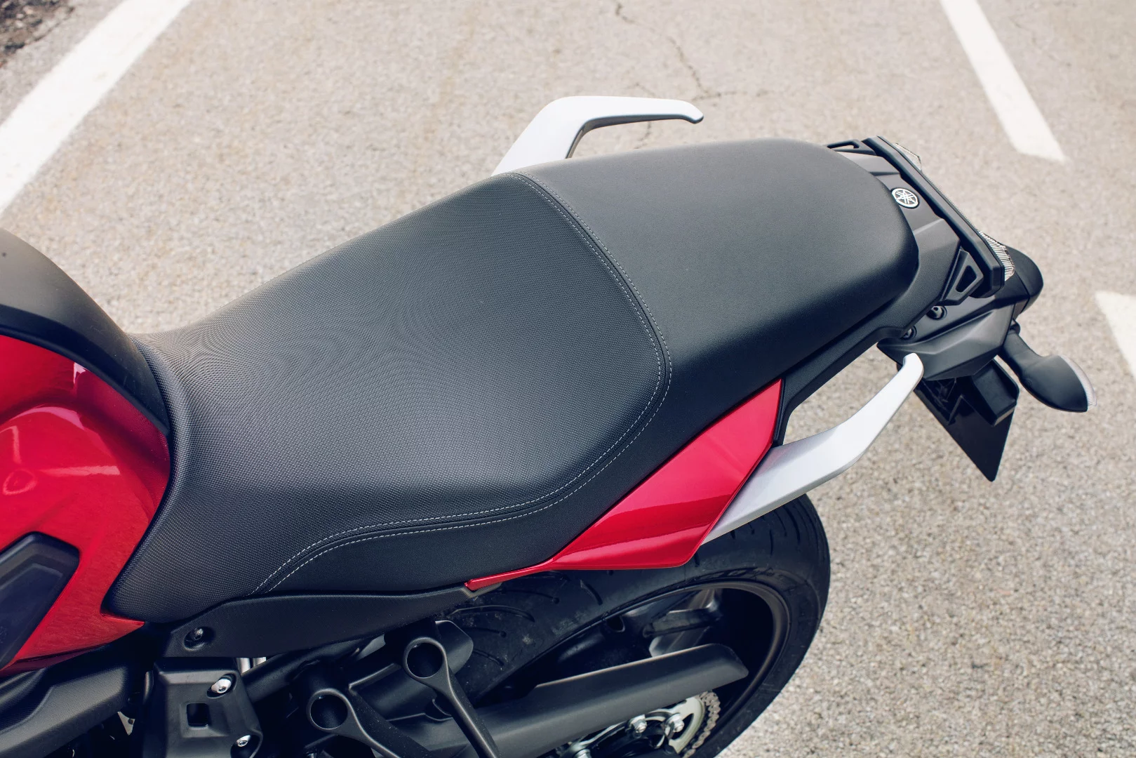 The single-piece seat of the Yamaha Tracer 700 is designed for comfortably hosting two passengers during long rides