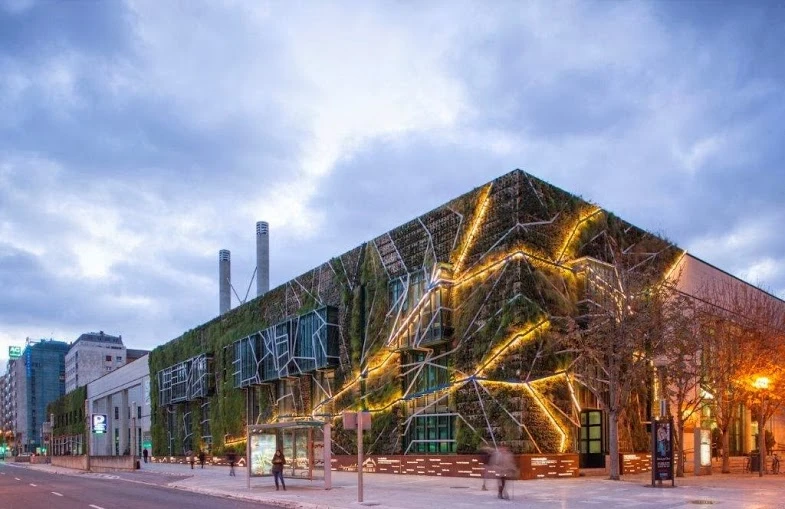 A wide corner view of the building with the frame lit-up