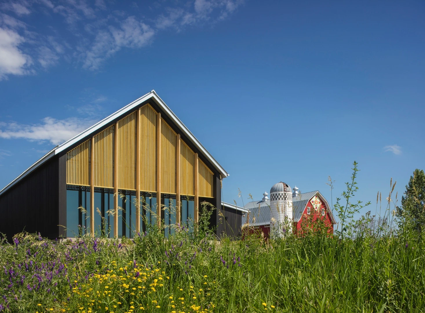 "The practical beauty of traditional farm buildings inspired the Bee Center’s simple forms, its siting, material selections, and its passive design strategies," says the AIA regarding the Tashjian Bee and Pollinator Discovery Center