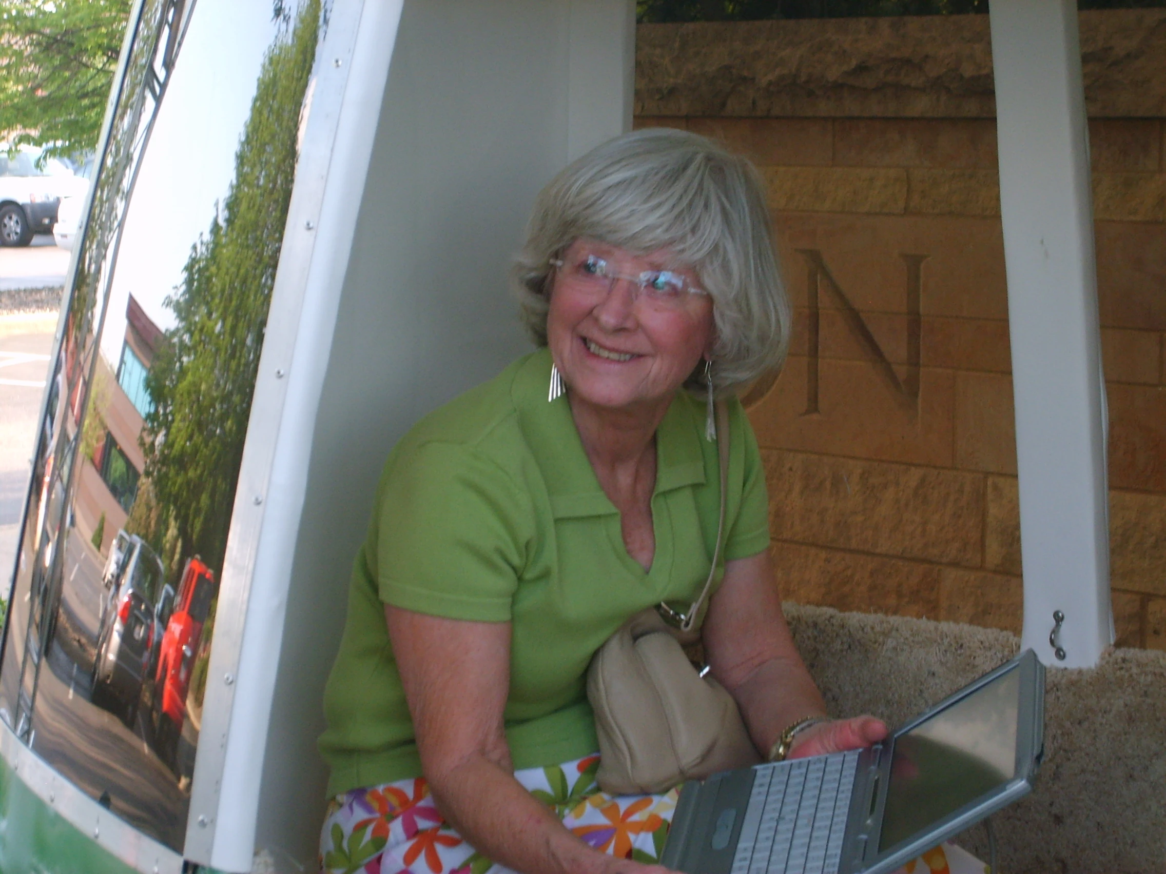 A user tries out the touchscreen control system of the JPod demo unit