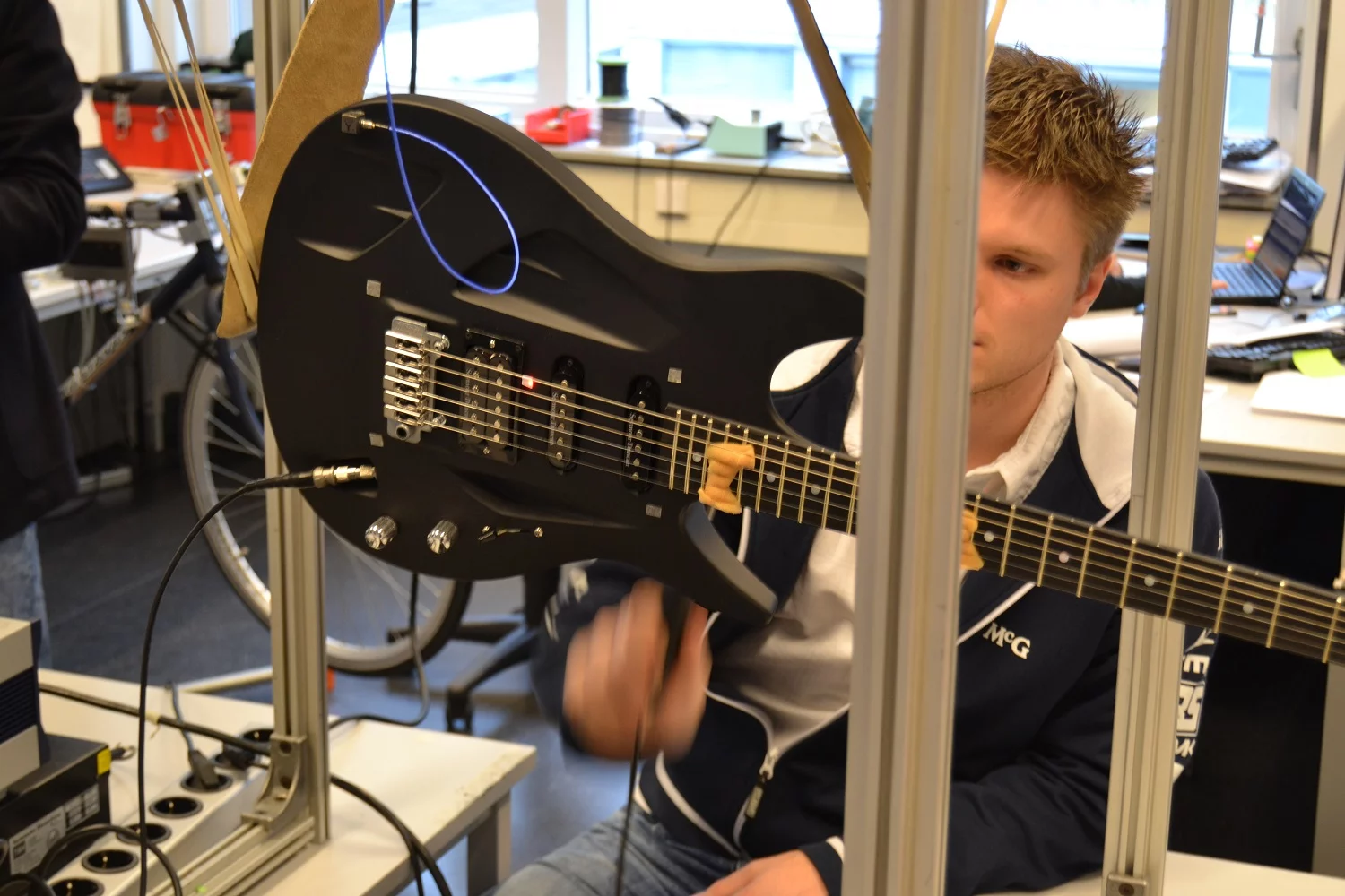 An Aristides Arium guitar undergoing acoustic testing