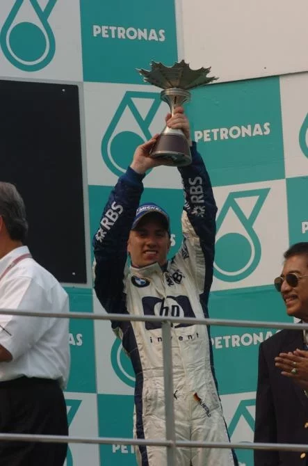 Nick Heidfeld takes to the podium for the first time
