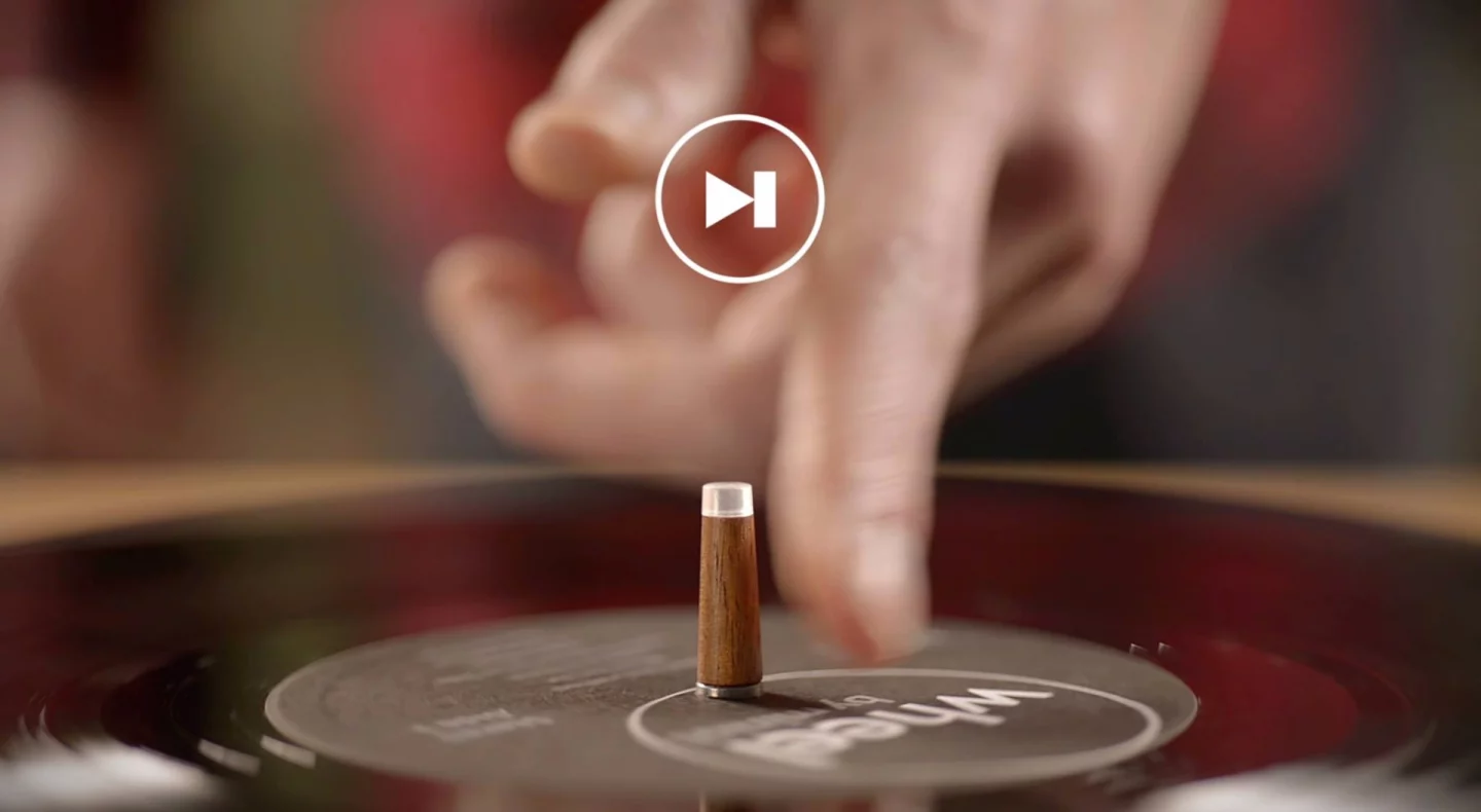 The Wheel's spindle, or center stick, is used to control operation and playback