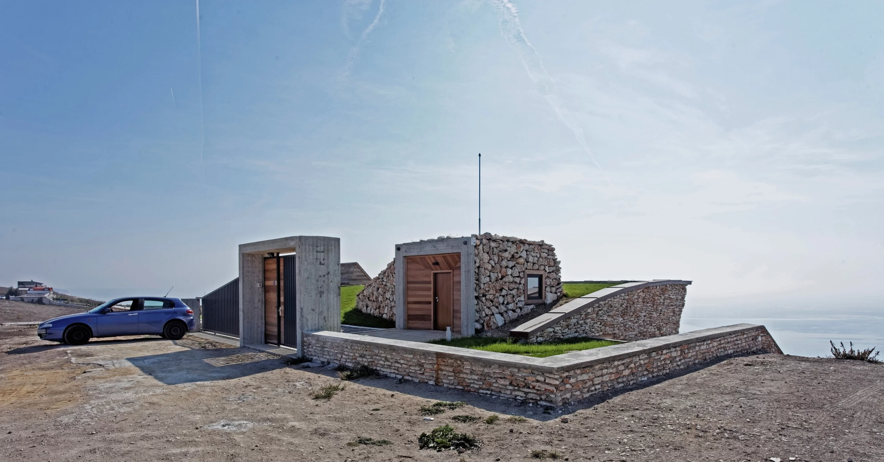 The building is cut into the hill (Photo: Ignatov Architects)