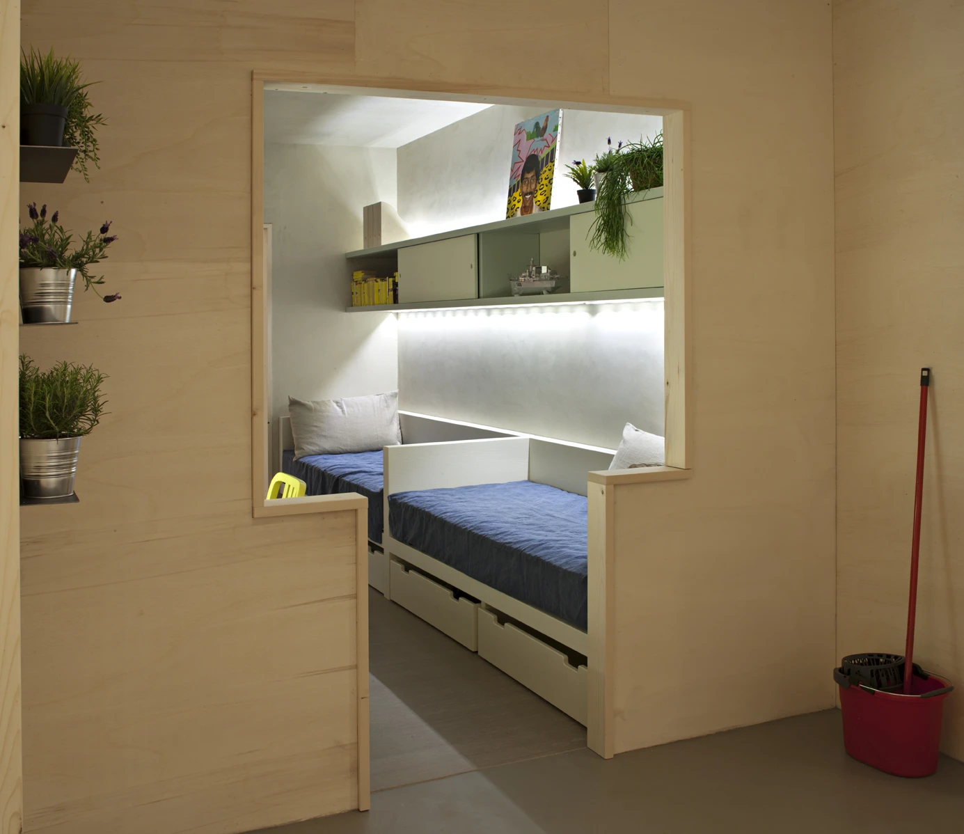 A bed becomes a closet, and a table can be used as a rudimentary gym