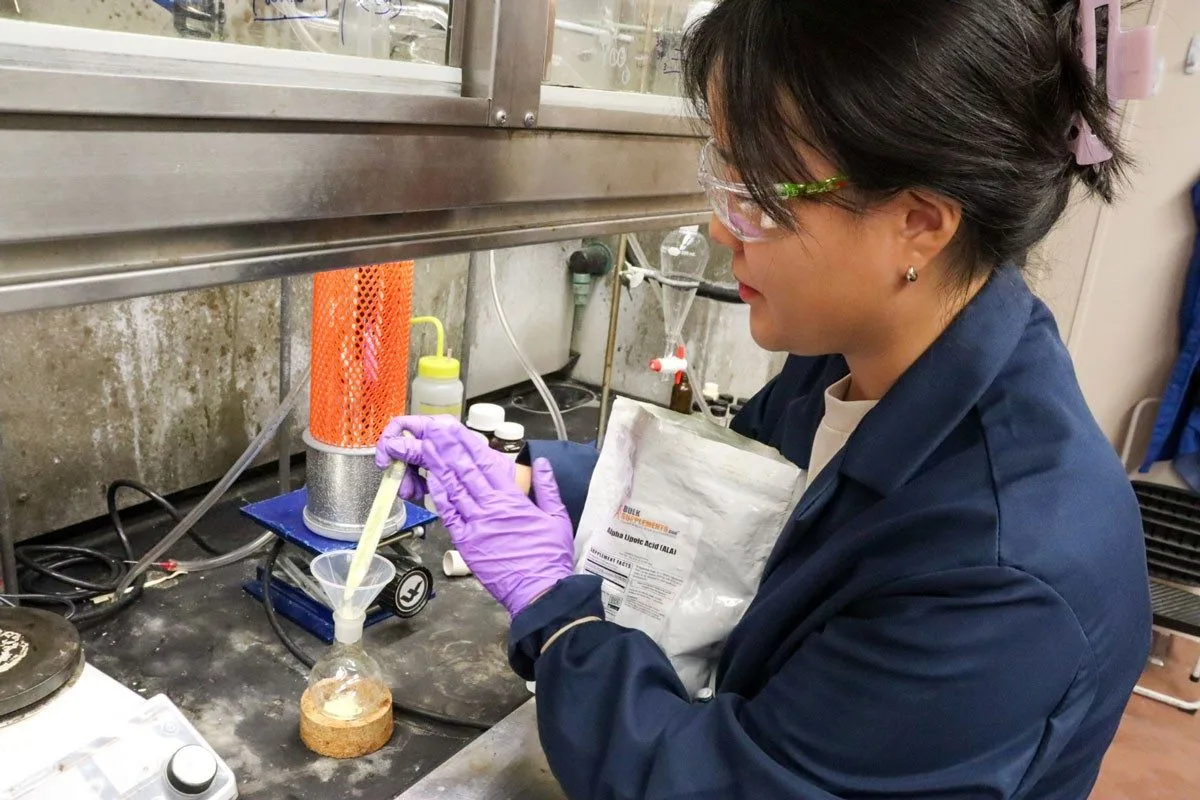 Graduate researcher Regina Ham works with a bottlebrush polymer
