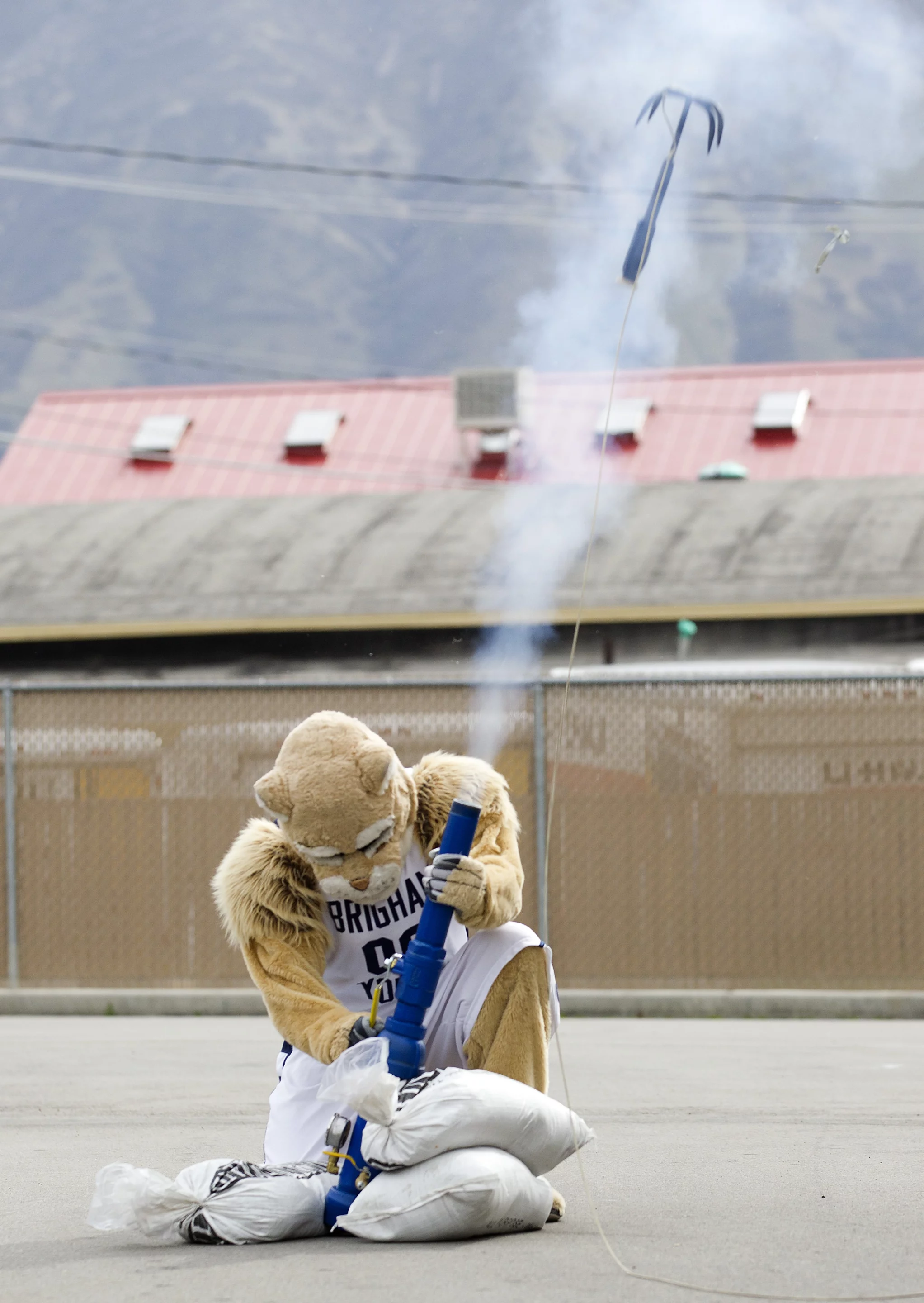 BYU mascot Cosmo helps demonstrate the engineering students' anchoring device