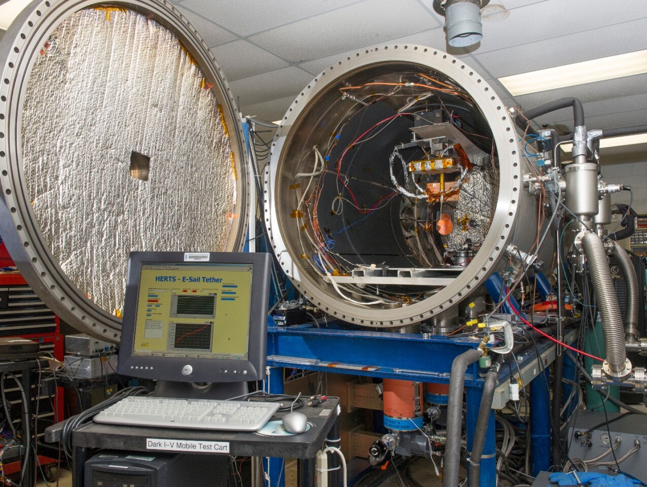 Within a controlled plasma chamber tests will examine the rate of proton and electron collisions with a positively charged tether