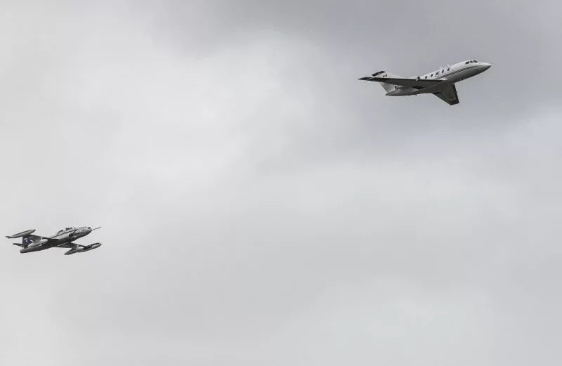 The 100 percent biofuel-powered Falcon 20 being tailed by the data-collecting T-33