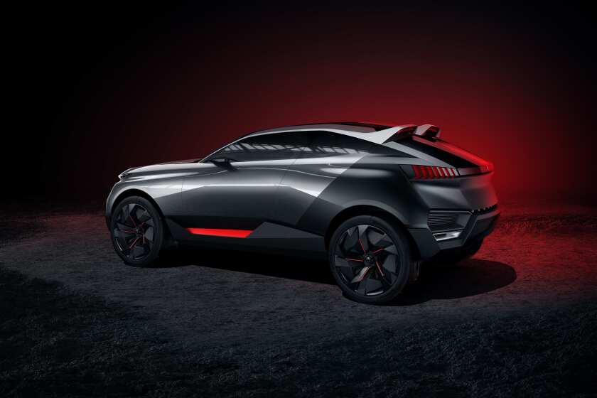 The matte black of the rear wings aligns with the roof spoilers