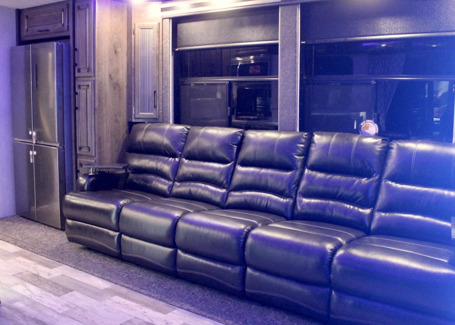 Heartland packs the living room with a five-seat couch, included on the base trailer and not just a concept add-on