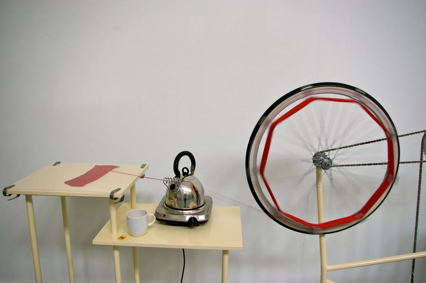 The unknitting machine is a student-designed device that uses human power to unravel old knitted clothes, so the yarn can be reused