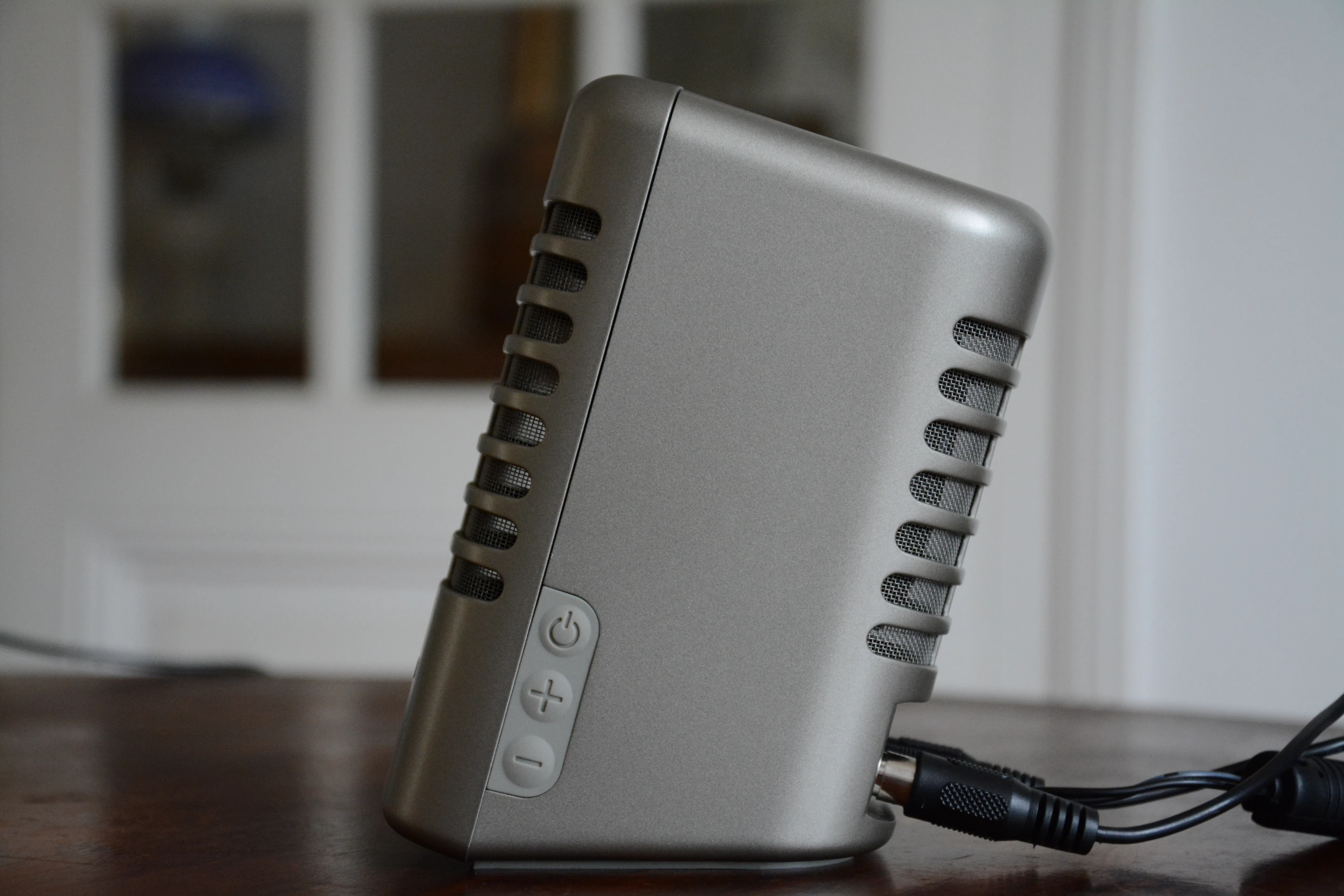 There are three soft-touch buttons on the side of the right speaker: one for power, another for volume up and one for volume down (Photo: Paul Ridden/Gizmag)