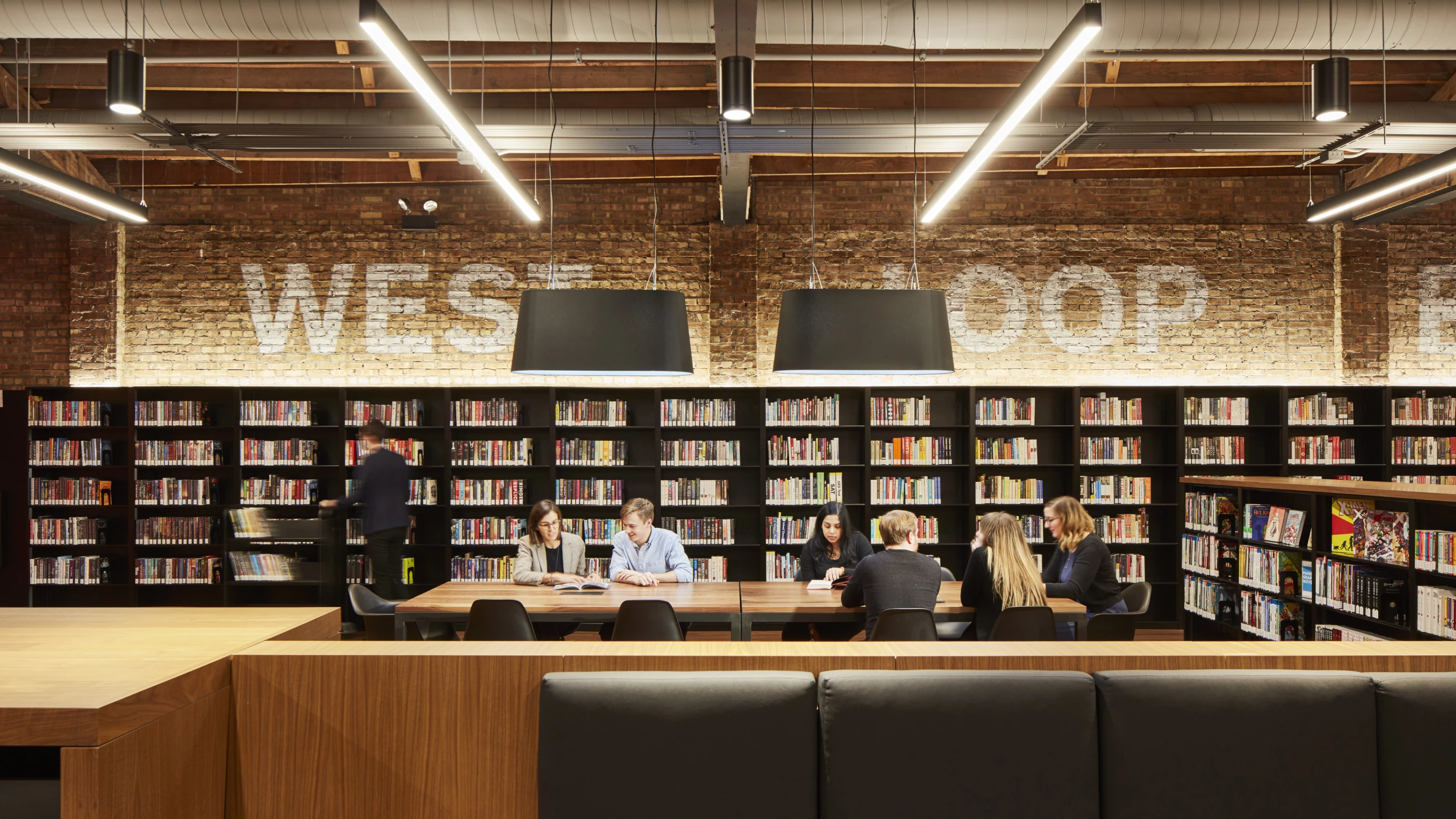 During the Chicago Public Library, West Loop Branch project, SOM preserved the original industrial decor of the buildings, removed unnecessary interior walls to open up the available space and increased the amount of natural light inside