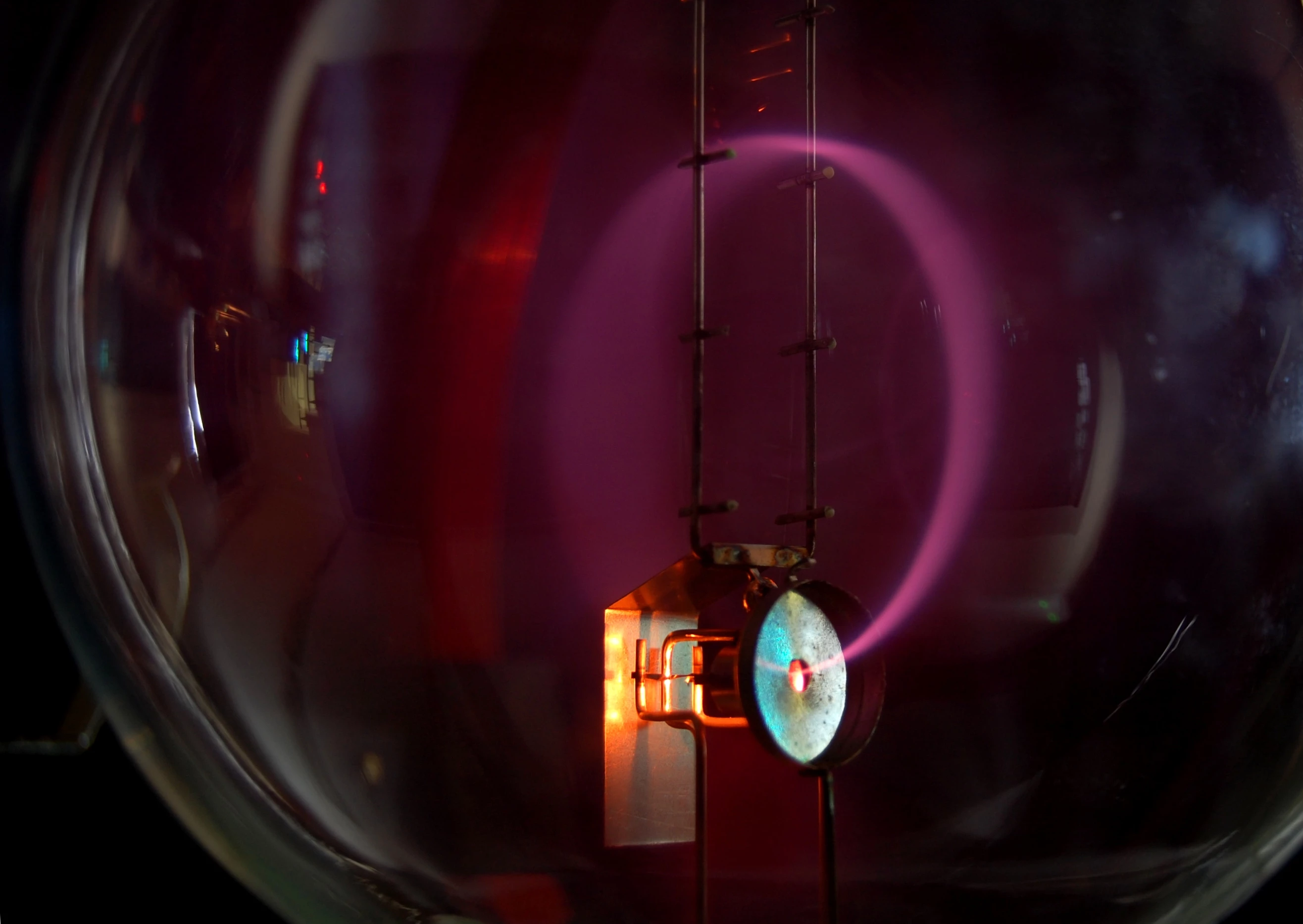 Electrons bent into a circular path by moving through a magnetic field (Photo: Marcin Bialek)