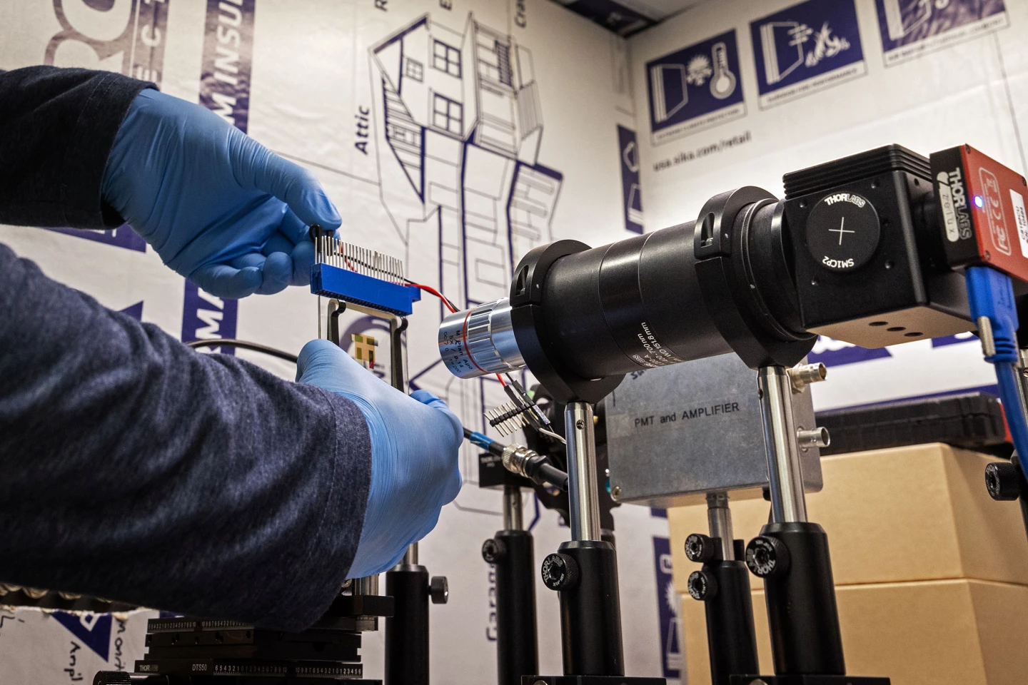 Raju Lampande using a microscope imaging system to research their OLED night vision technology