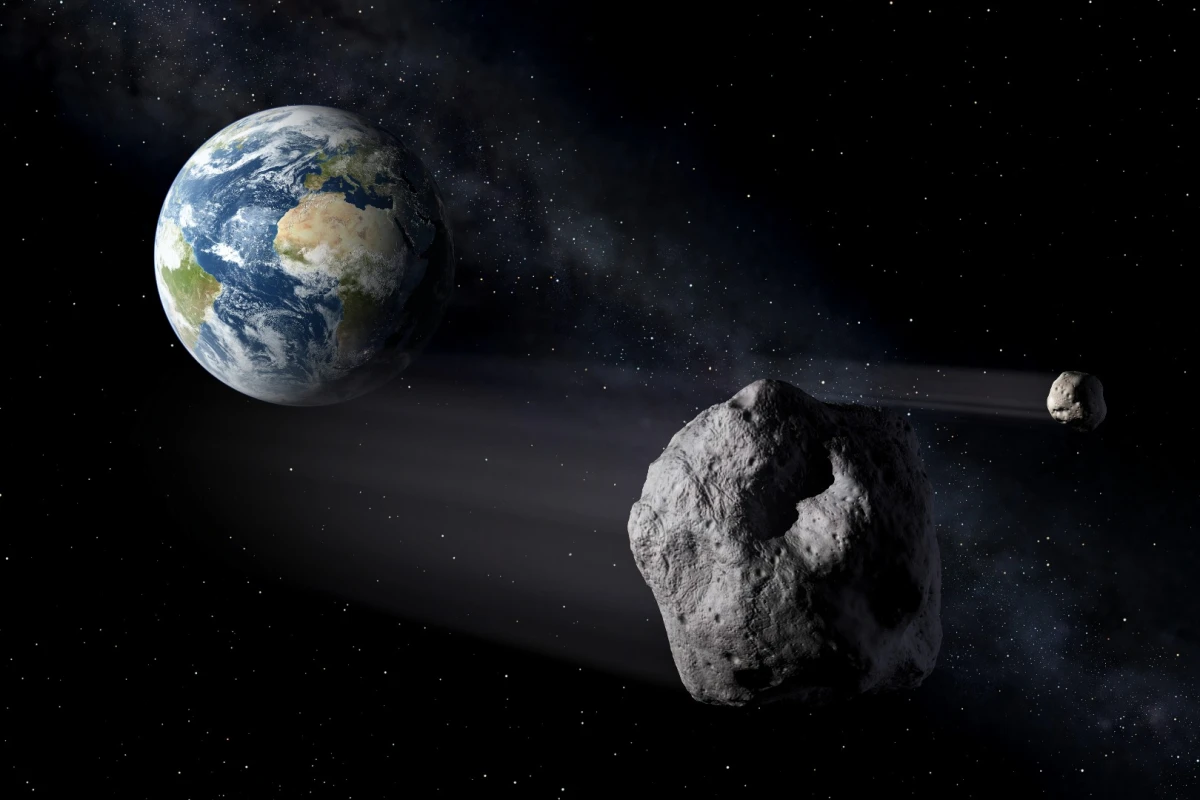 An artist's illustration of an asteroid passing close by Earth