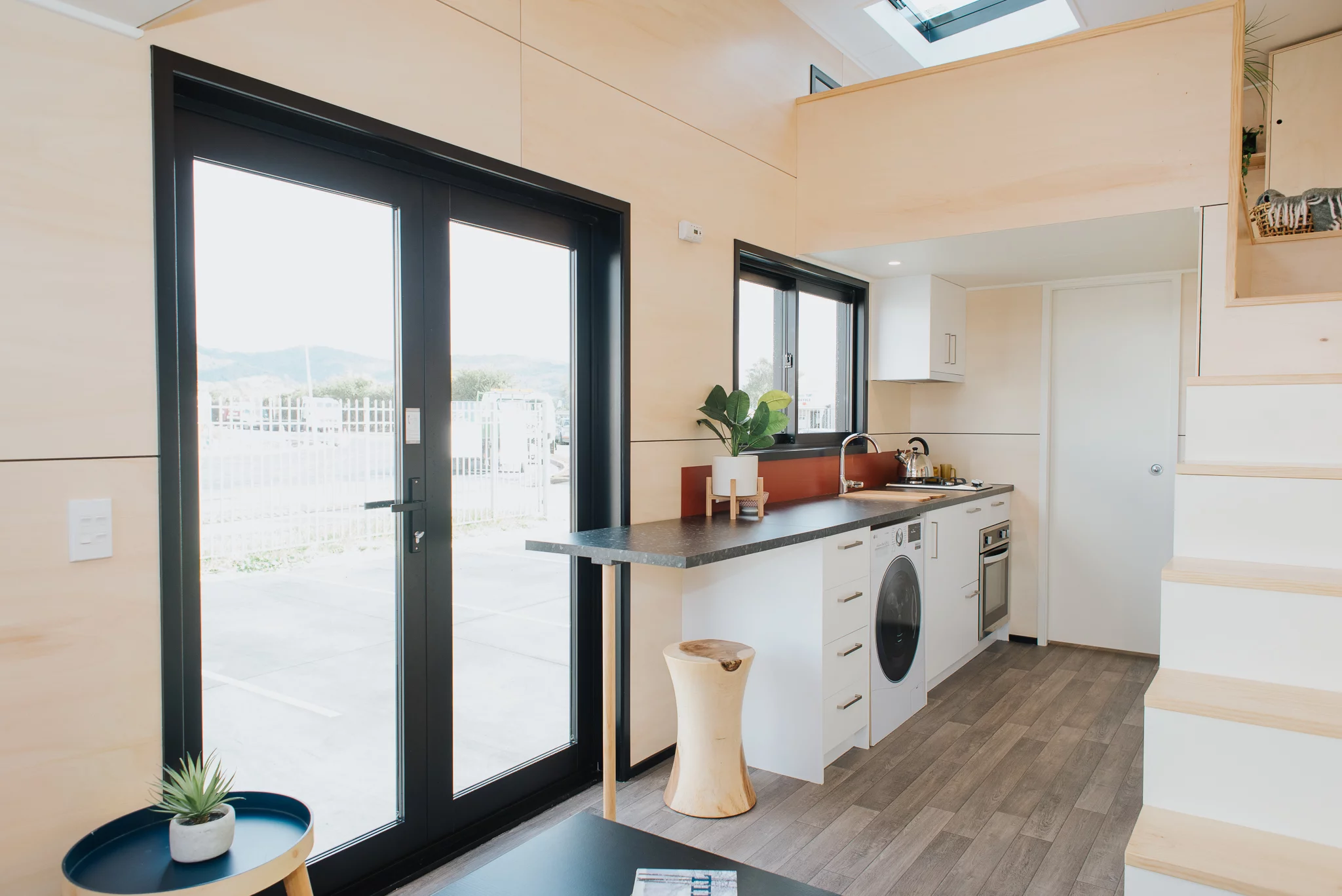 The Daisy Vera Tiny House has a small fold-up table that extends the available counter space