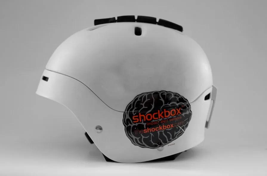 The Shockbox Sensor mounted on top of a snow sports helmet
