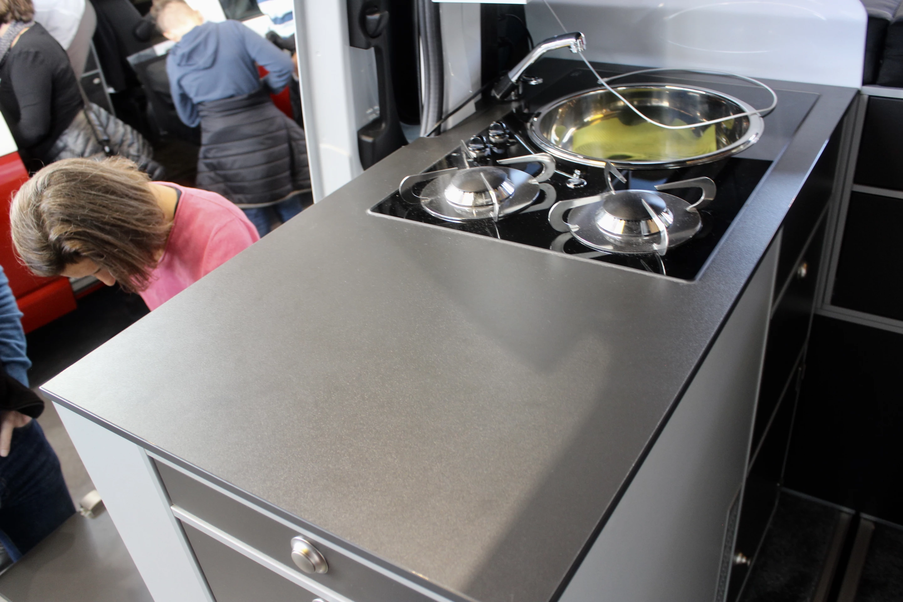 The indoor kitchen block also includes a slide-out fridge at the end, accessible from inside or out