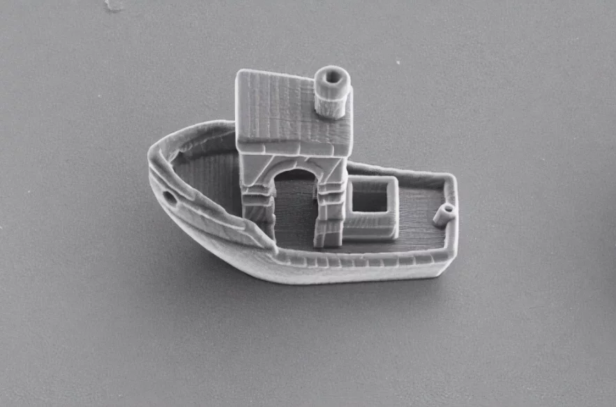 3DBenchy is a tiny 3D-printed boat, just a third of the thickness of a human hair