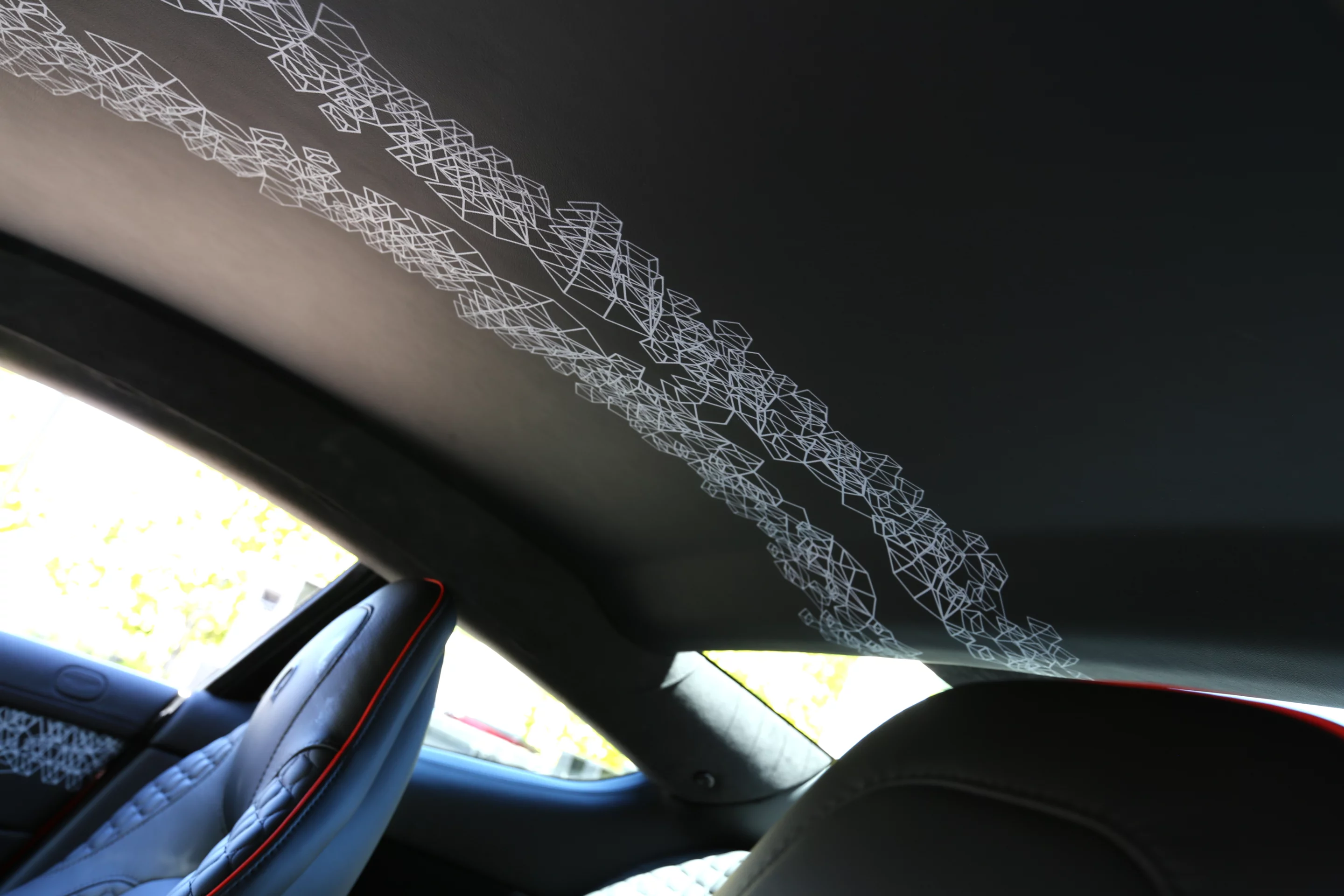 The roofliner on this Q-series Vanquish featured an unconventional graphic treatment not normally found in an Aston Martin (Photo: Angus MacKenzie/Gizmag.com)