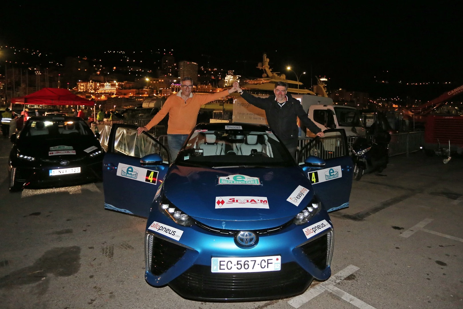 Winning driver Artur Prusak (left) and co-driver Thierry Benchetrit (right) celebrate their victory in the inaugural E-Rally Monte Carlo