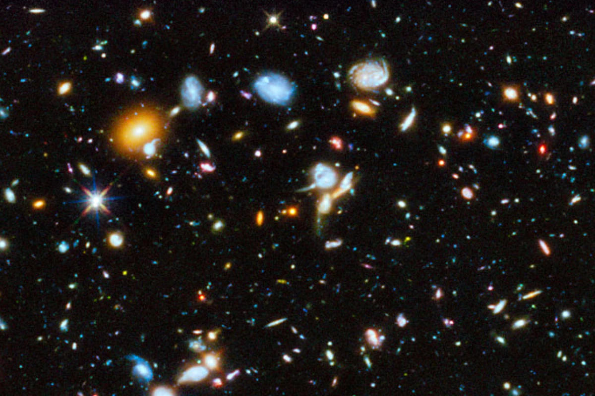 The Hubble Space Telescope has taken a long-exposure picture of space in the ultraviolet, revealing newly formed stars and galaxies (Image: NASA/ESA)