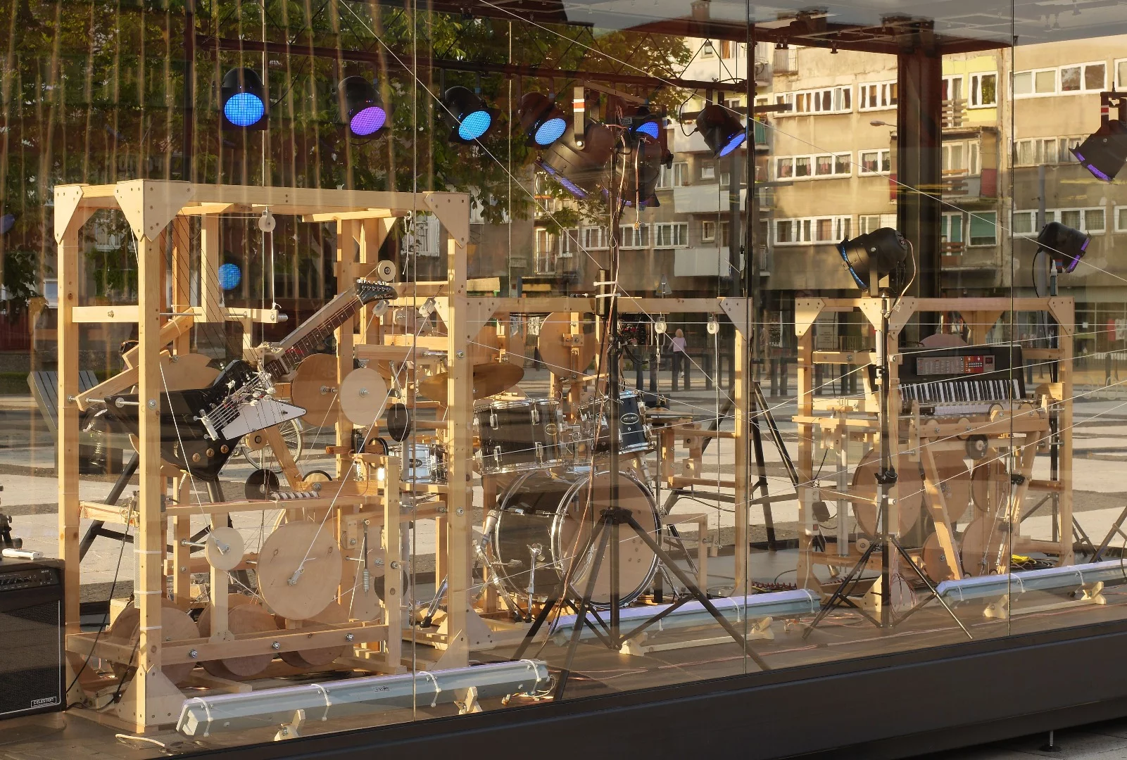 The Music Construction Machine is made up of three instruments, each housed in their own wooden cage