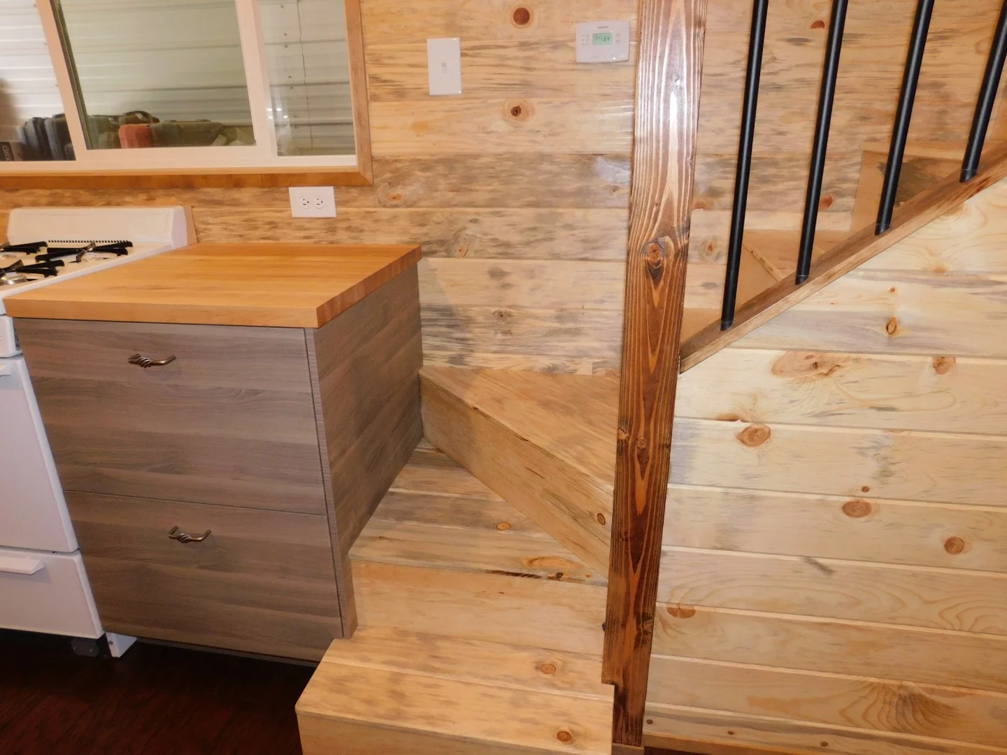 The Purple Monster's staircase isn't a tiny house-style storage staircase but does have a closet underneath