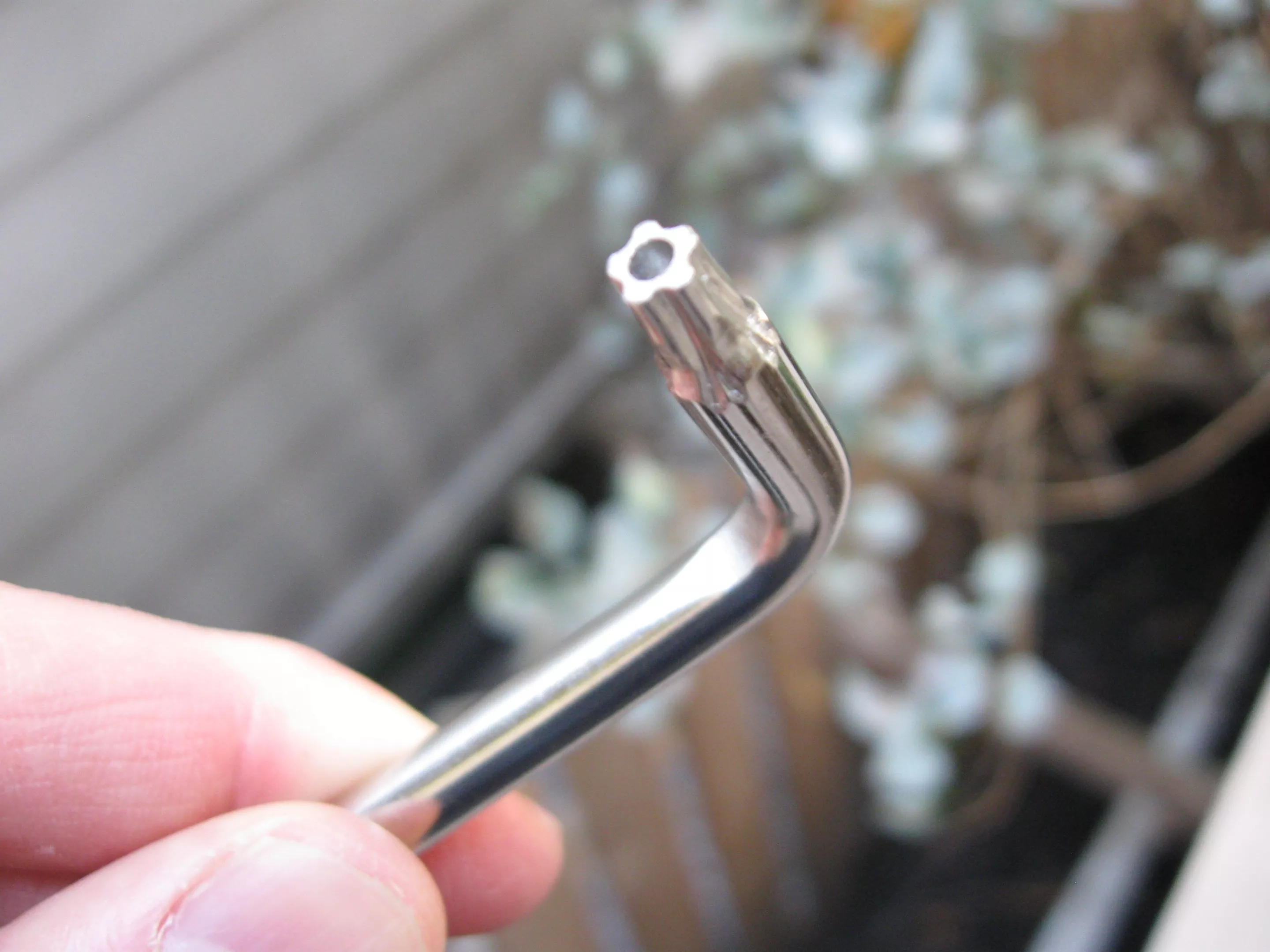 A close-up of the included security screwdriver