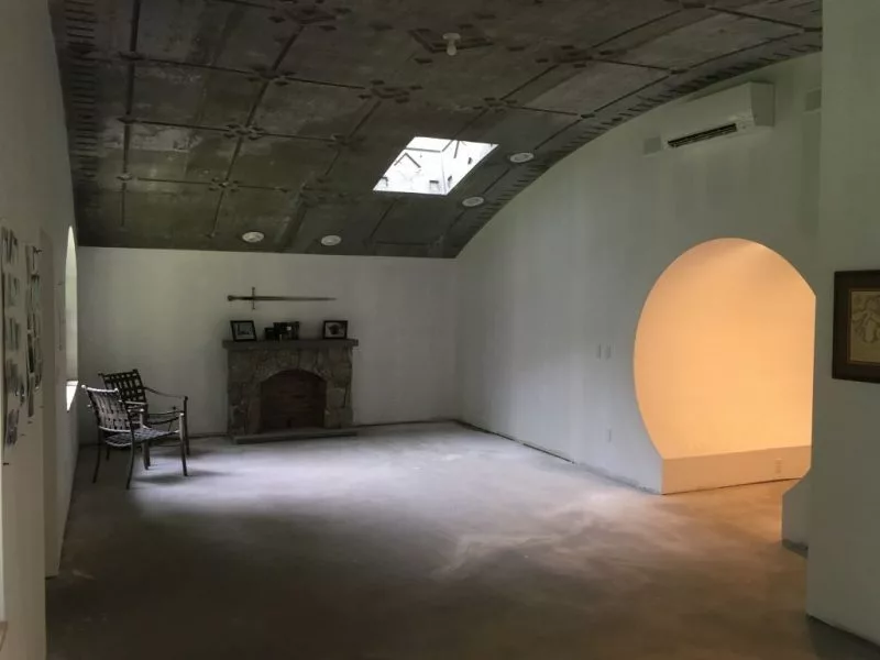 Hobbit Hollow's interior isn't yet finished but includes some nice touches like a replica sword hanging over the fireplace