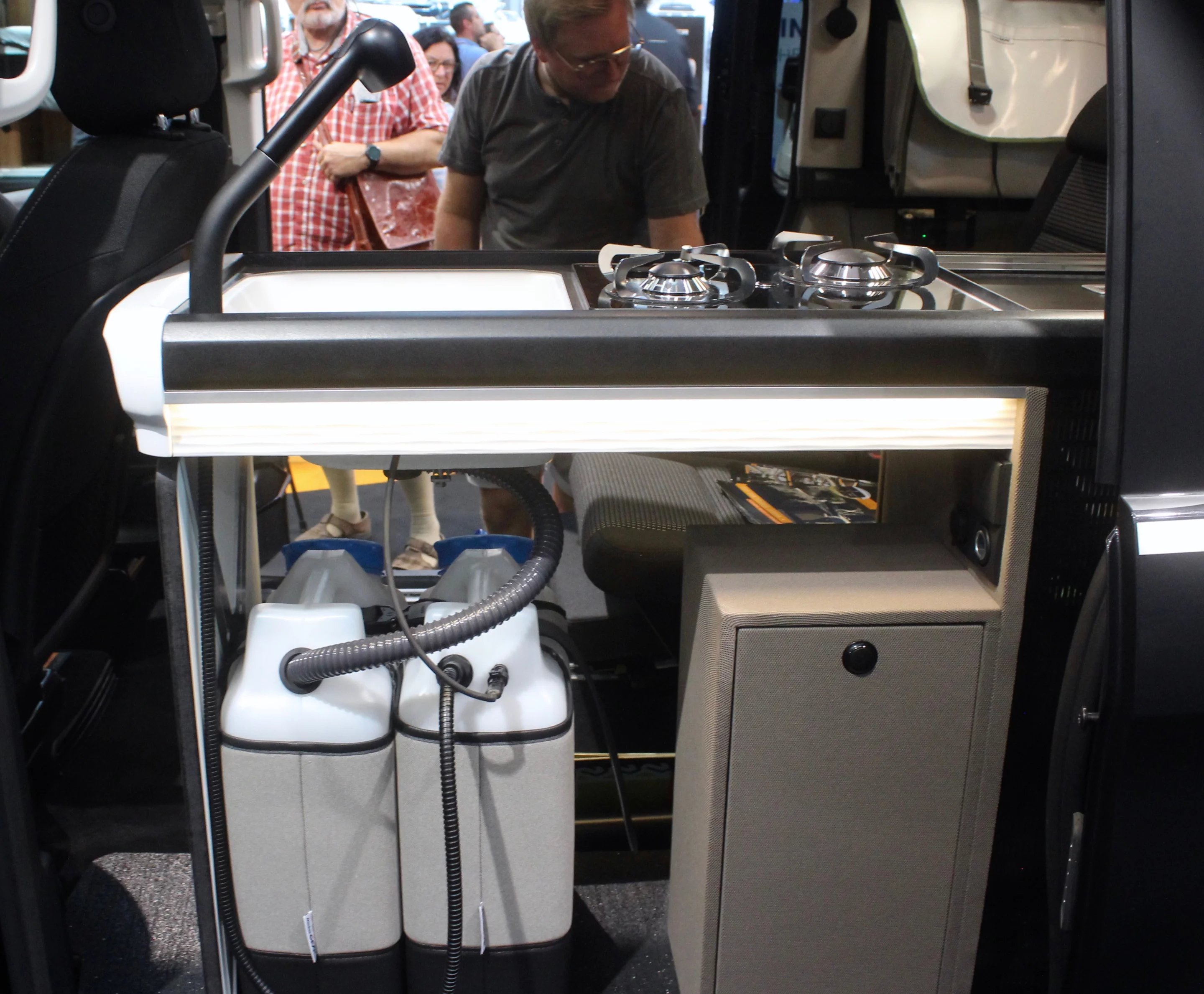 A closer look at the open design of the kitchen area, complete with easily removable water canisters