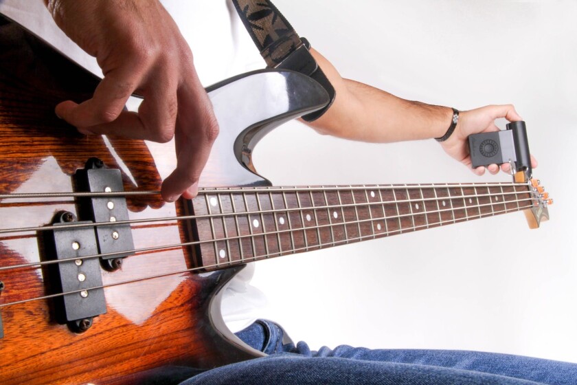 The motorized peg turner at the end of the Roadie Bass automatically brings a plucked string to pitch