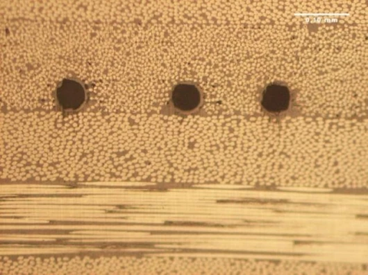 Hollow glass fibers embedded in composite material